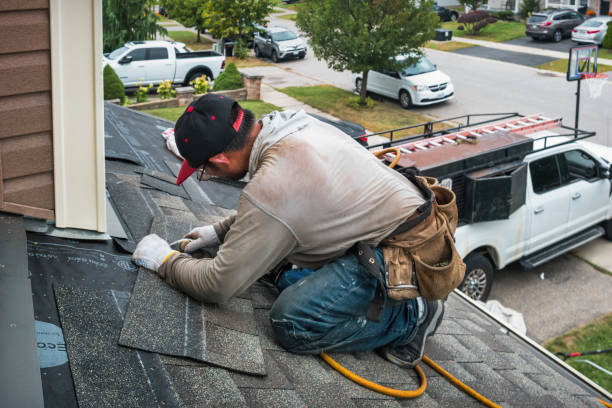 Professional Roofing technician working in Peru, IA